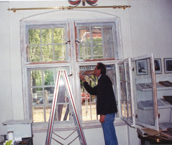 Mr. Lampeitl, the Architect, inspecting the Mission House windows