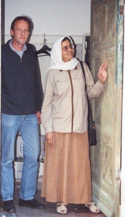 Sister Samina inspecting the front door of Mission House, with Architect
